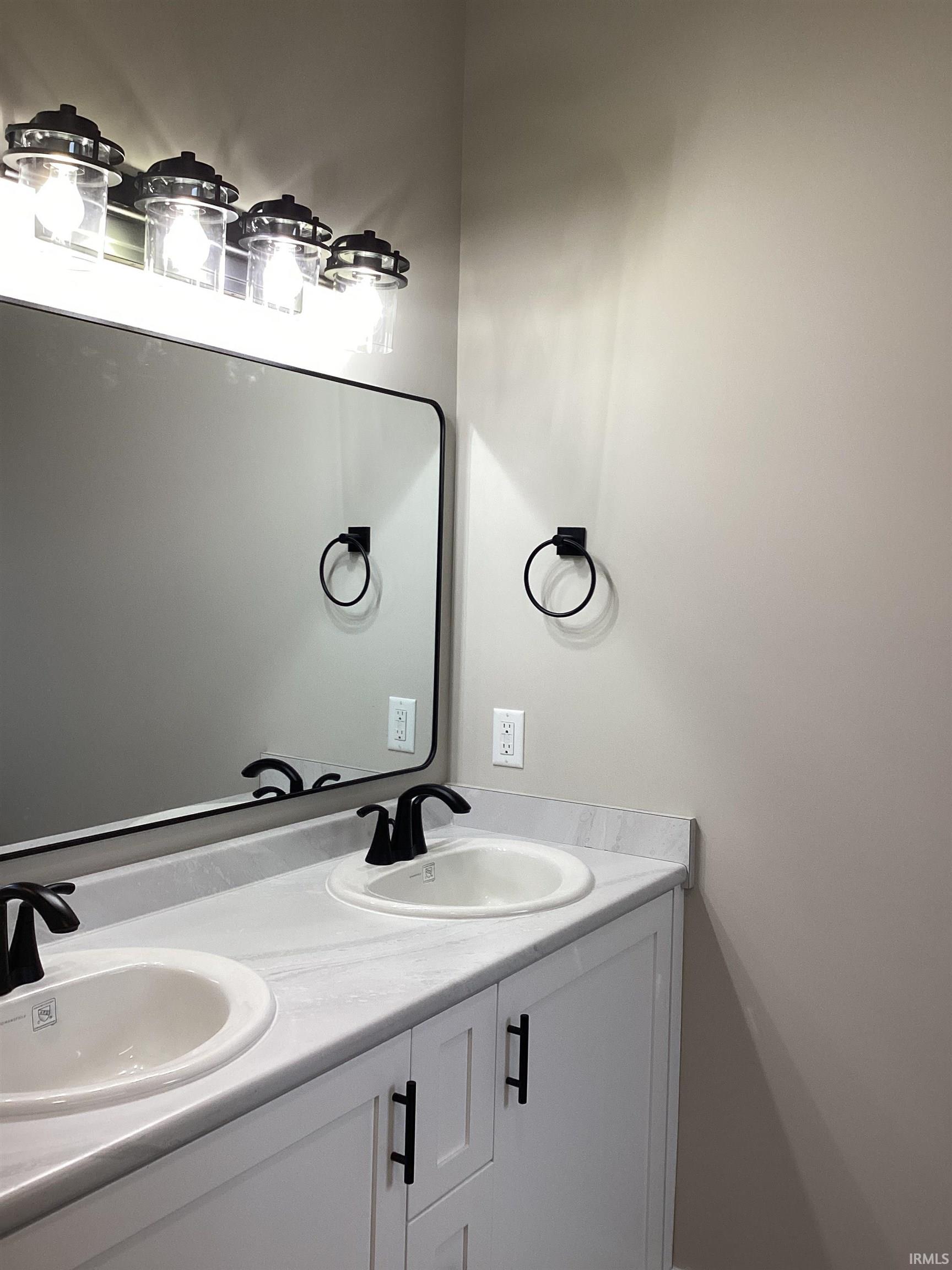 Bathroom featuring double vanity