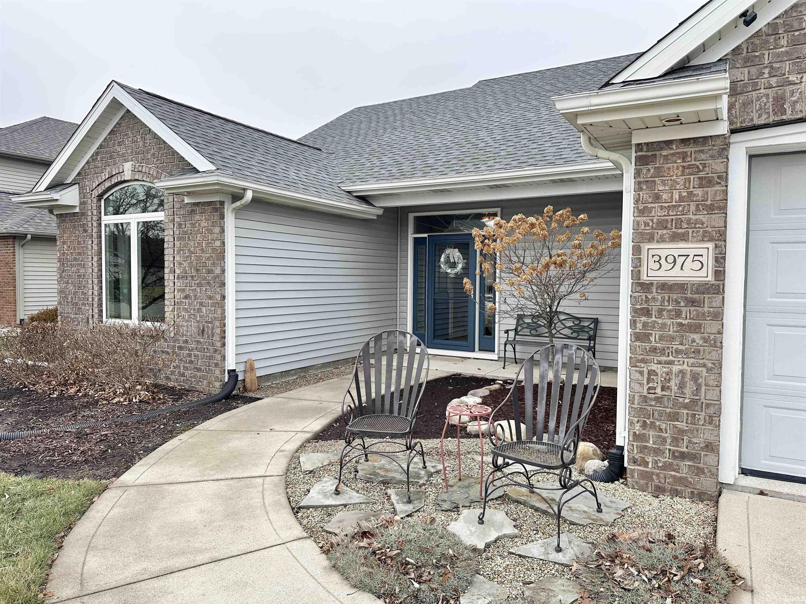 Property entrance with a shingled roof