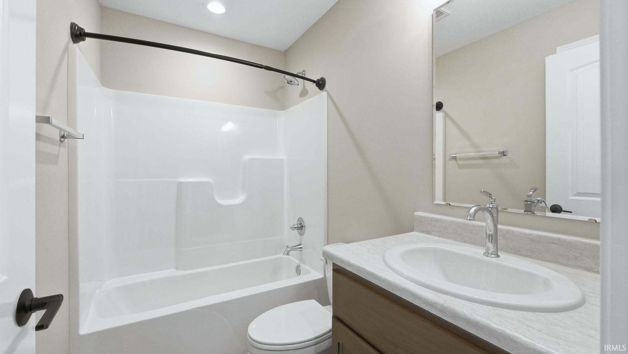 Bathroom featuring vanity and tub / shower combination