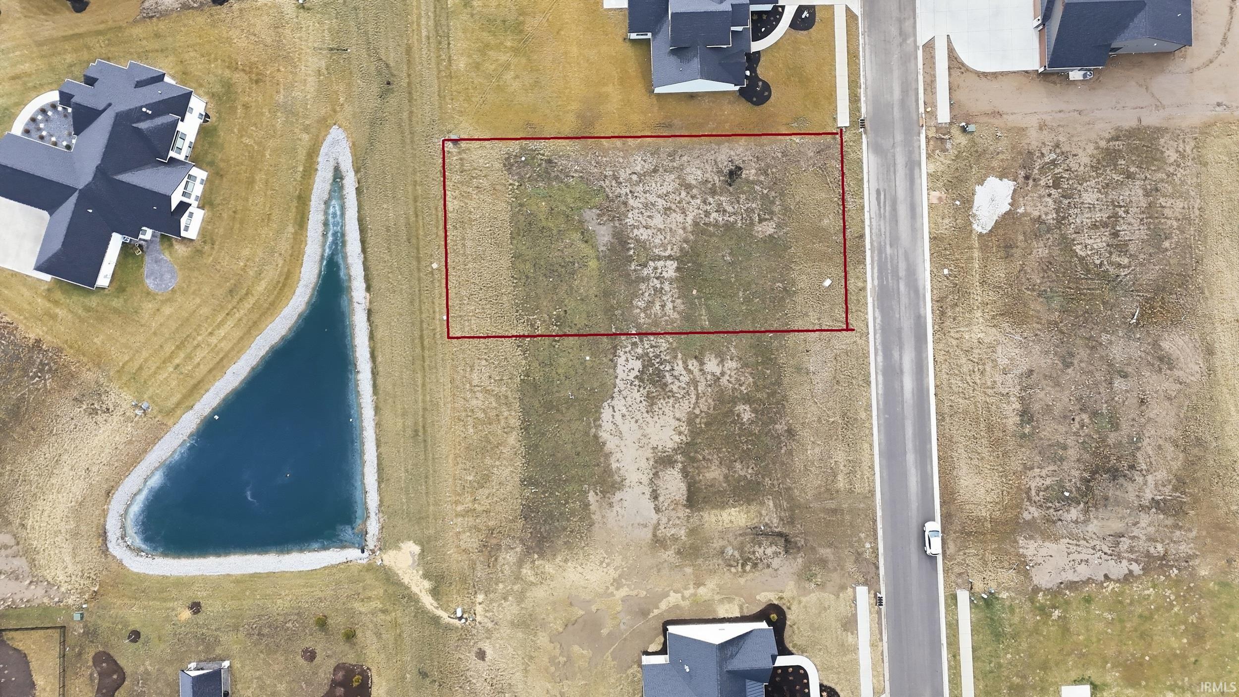 Aerial view of property and surrounding area with property boundaries highlighted