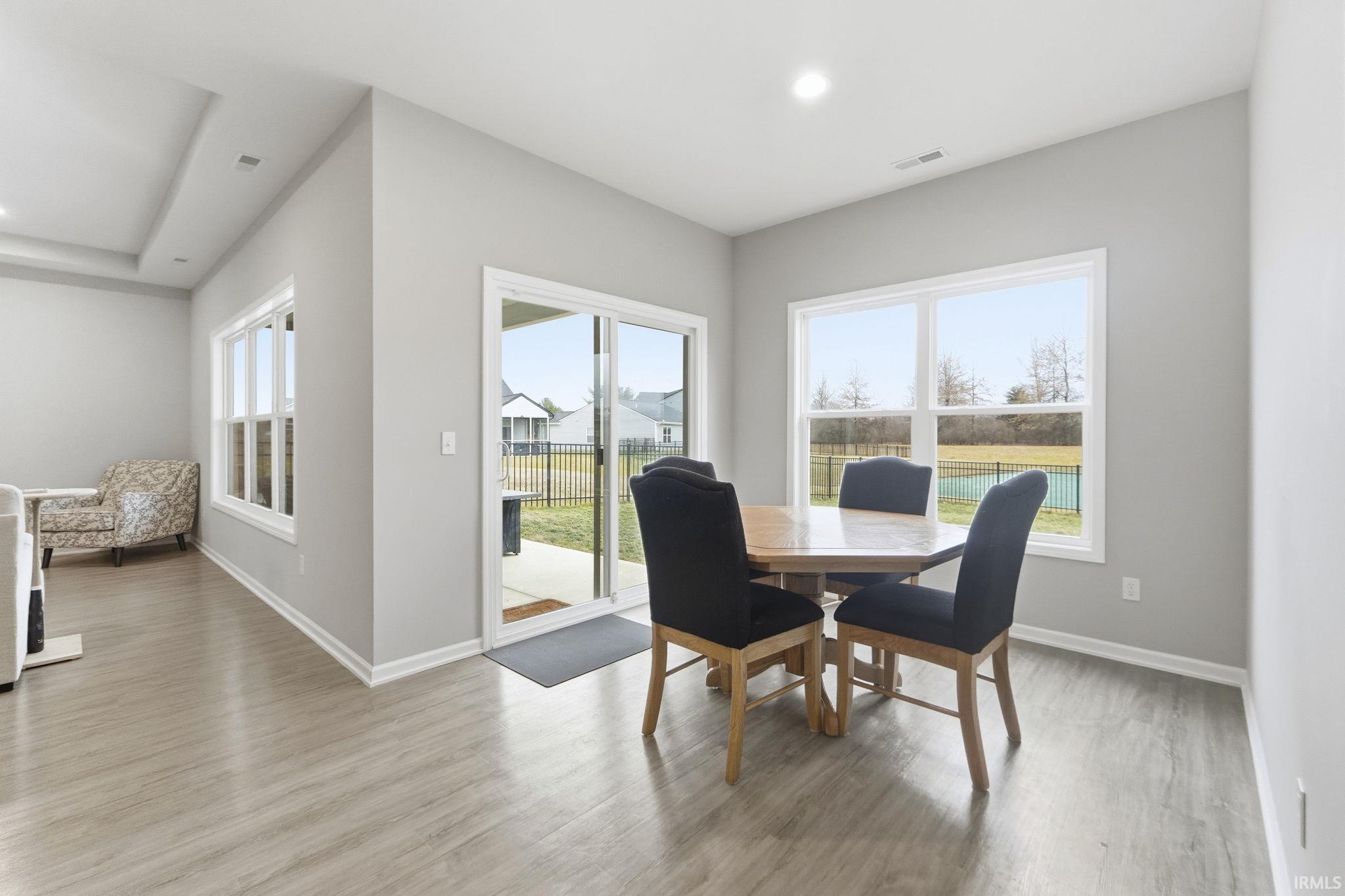 Dining area featuring light wood-type flooring and recessed lighting