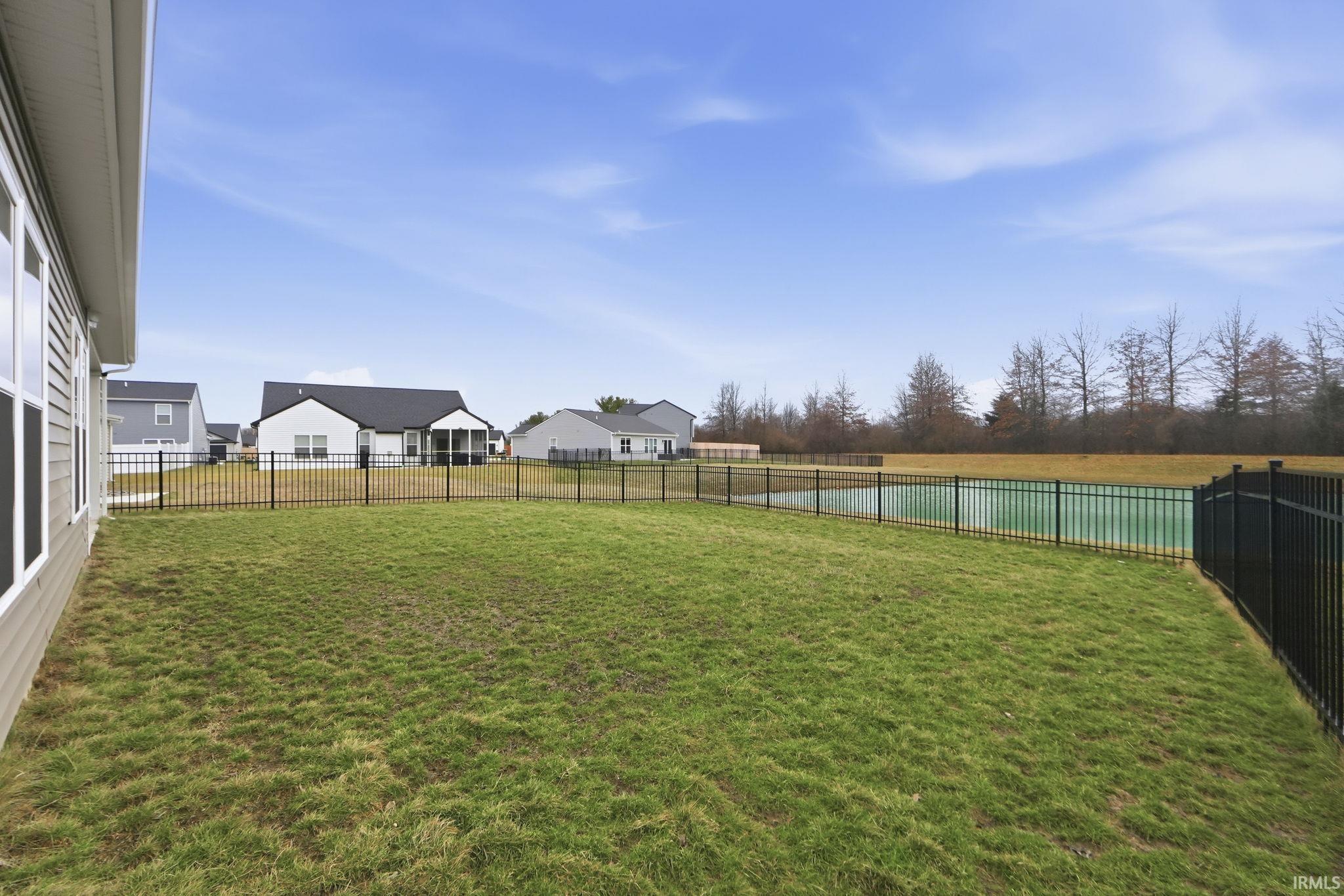 View of fenced backyard