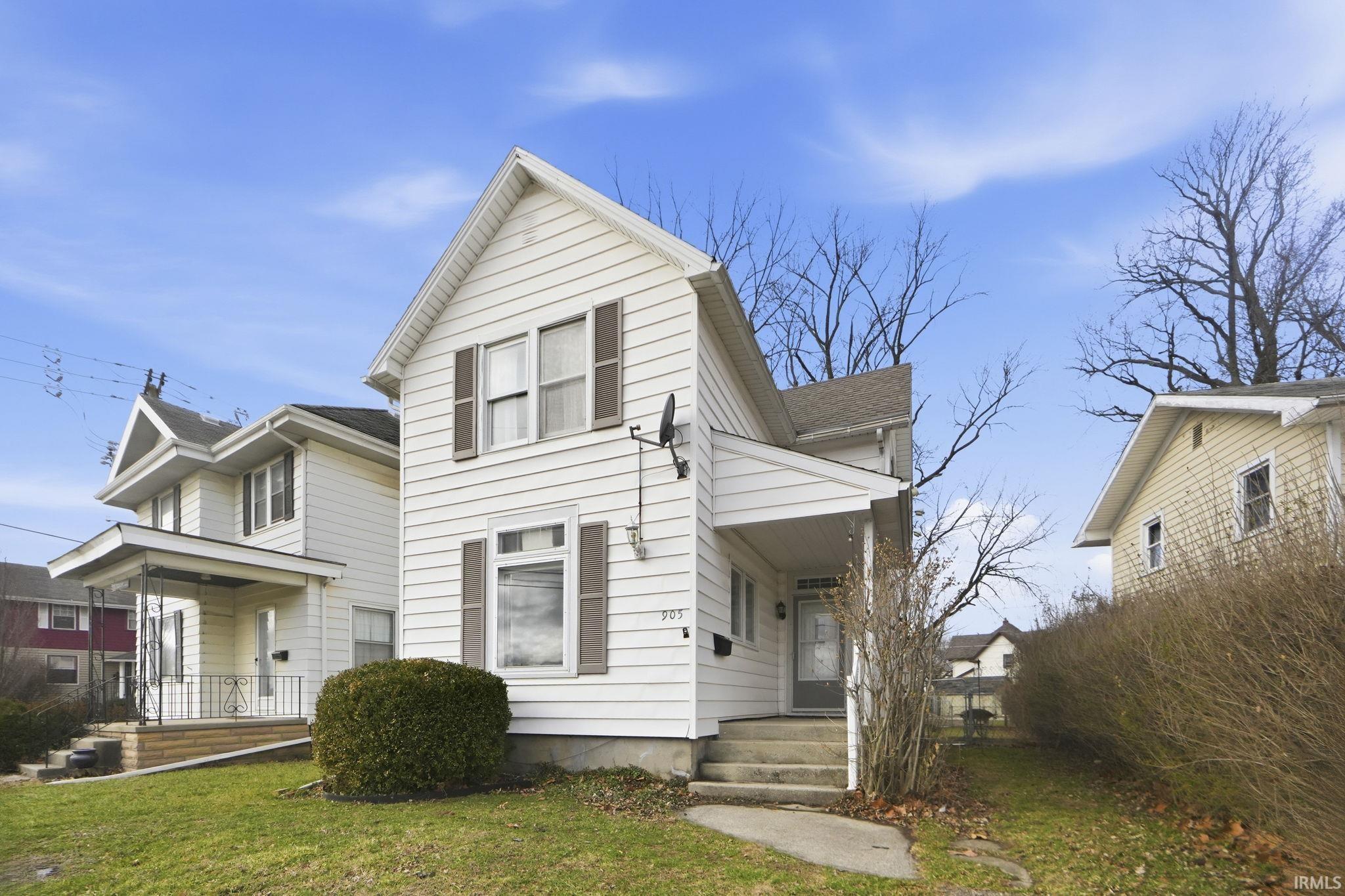 View of front of property with a front lawn
