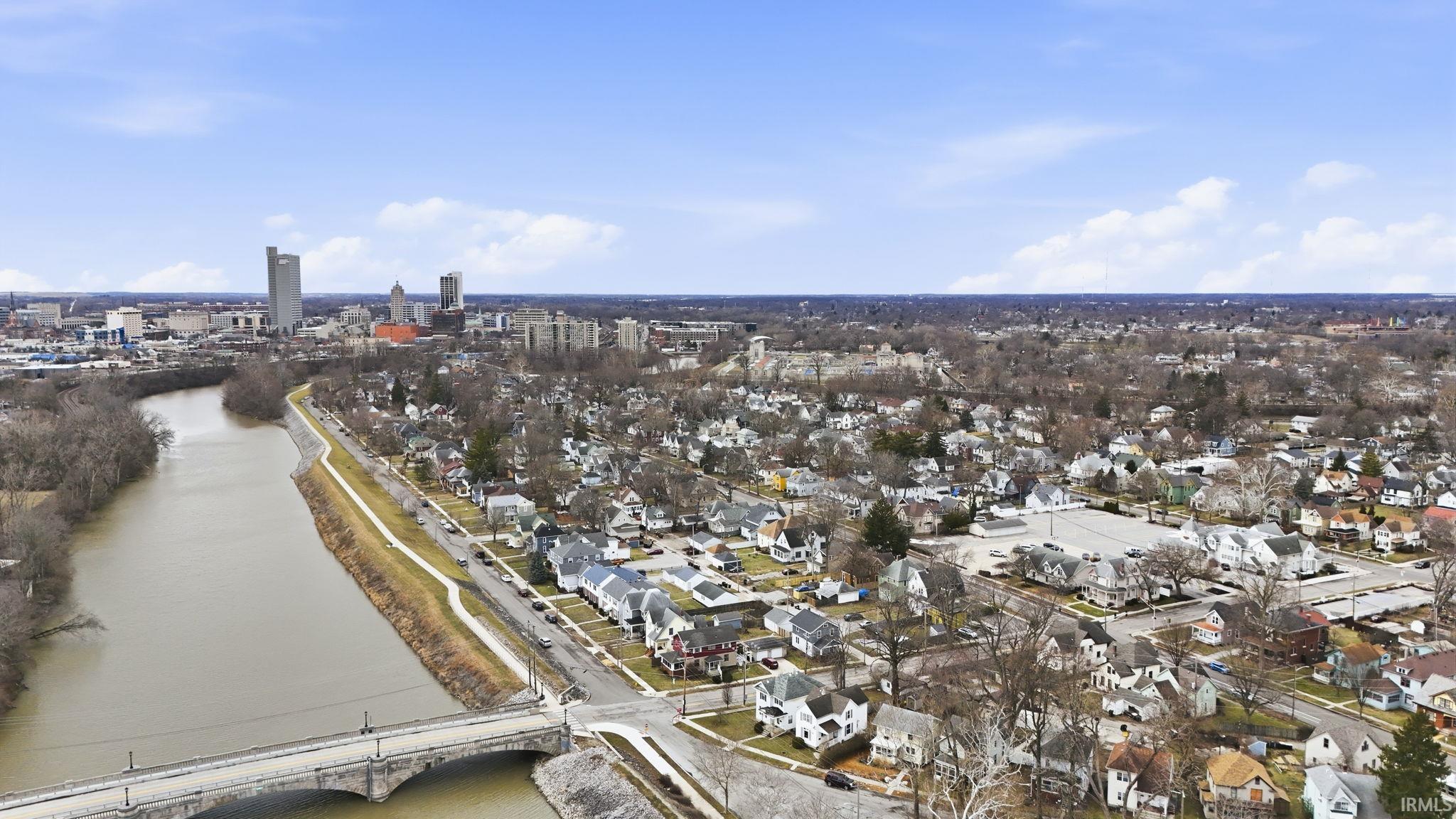 Aerial overview of property's location featuring a notable bridge and nearby suburban area
