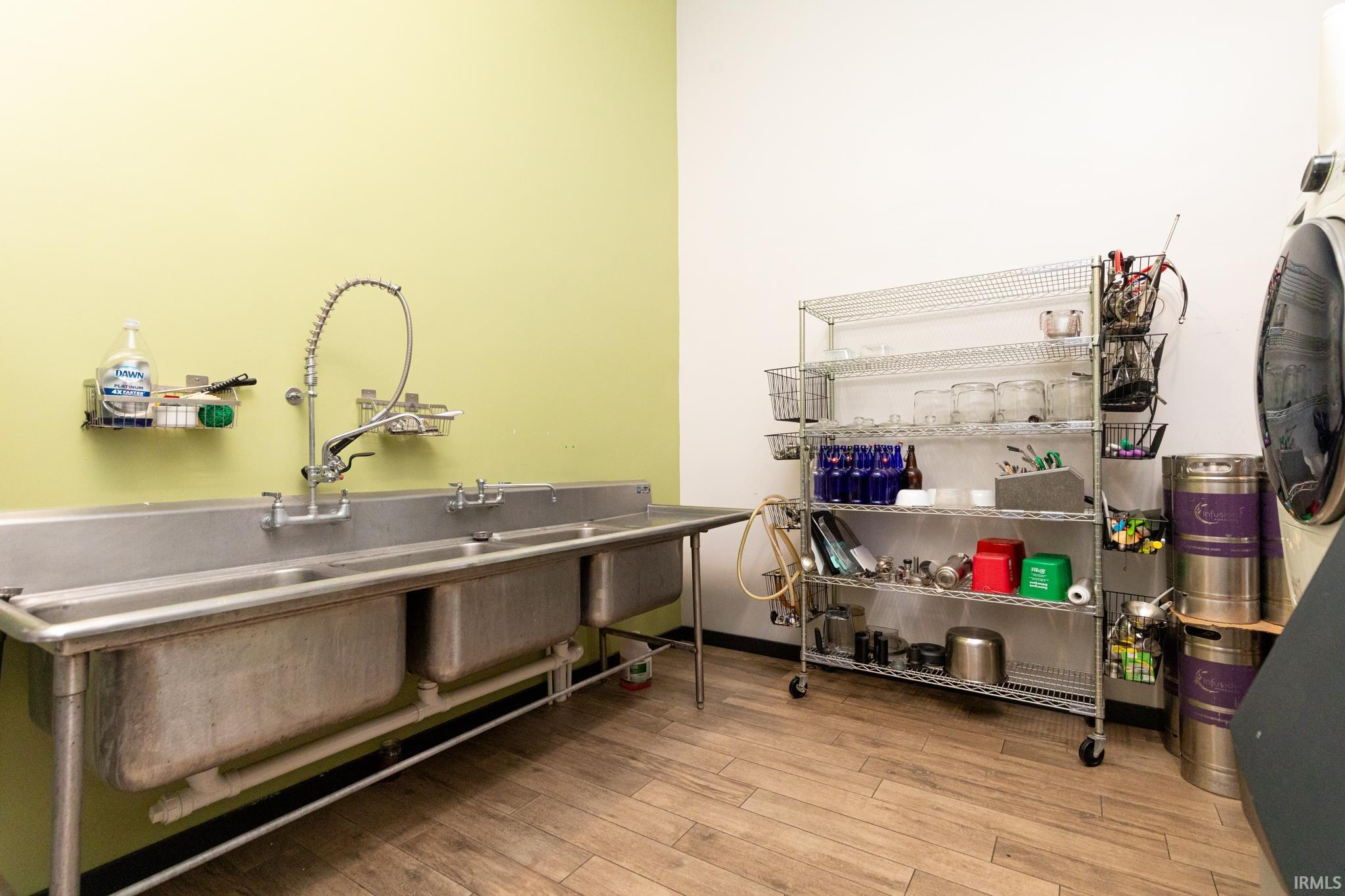 Misc room featuring light wood finished floors and washer / dryer