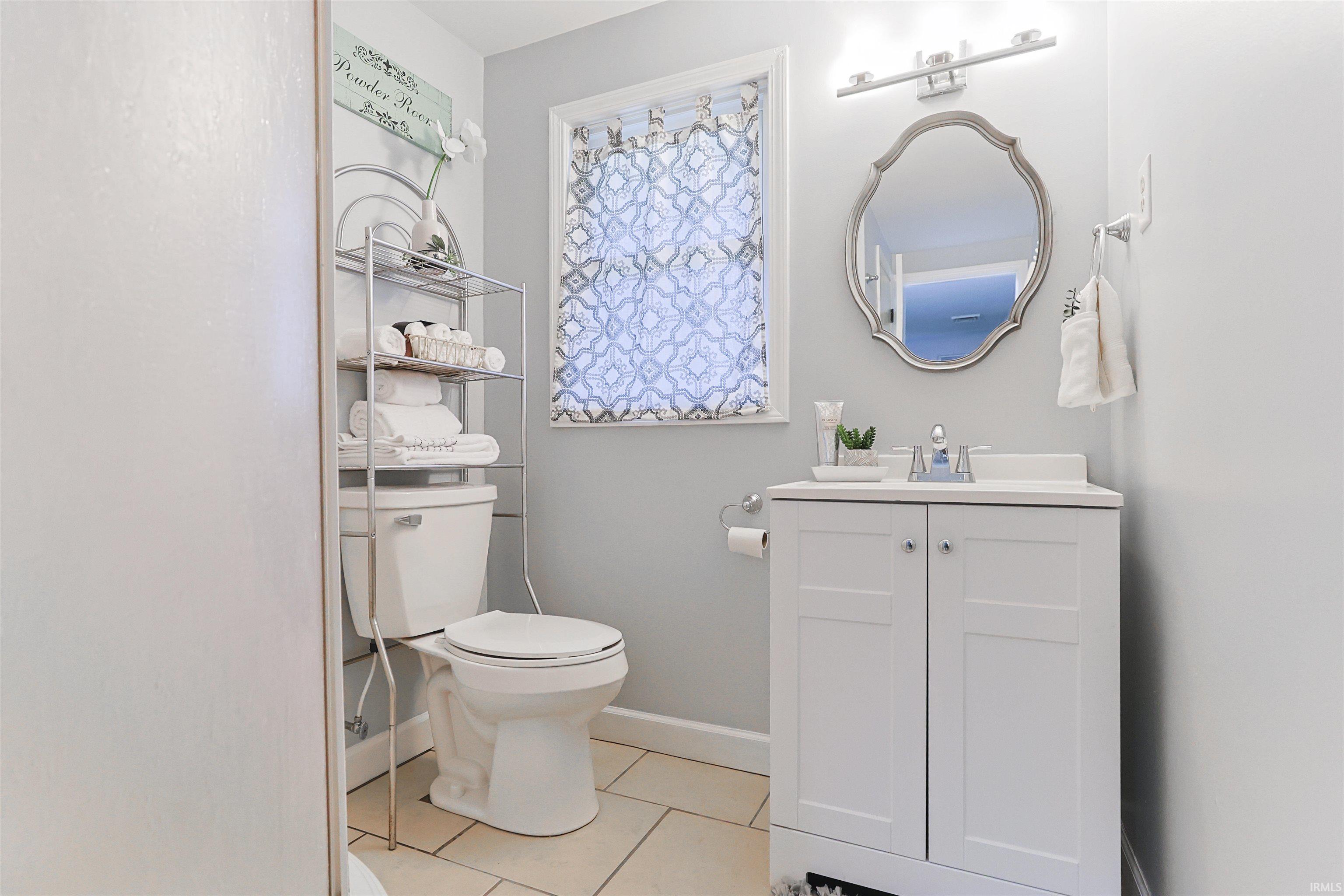 Bathroom featuring vanity and light tile patterned flooring