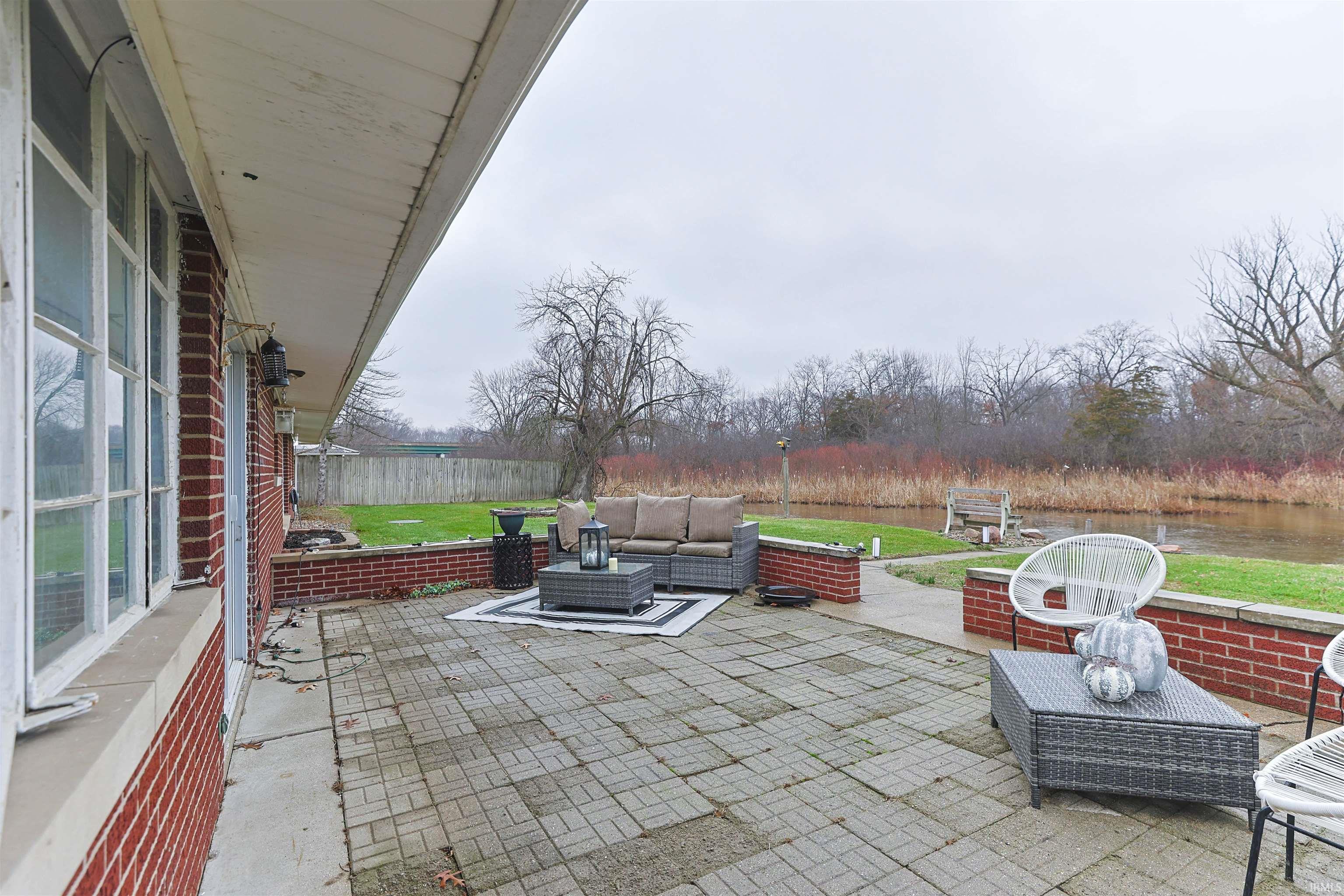 Fenced backyard with a patio area and an outdoor hangout area