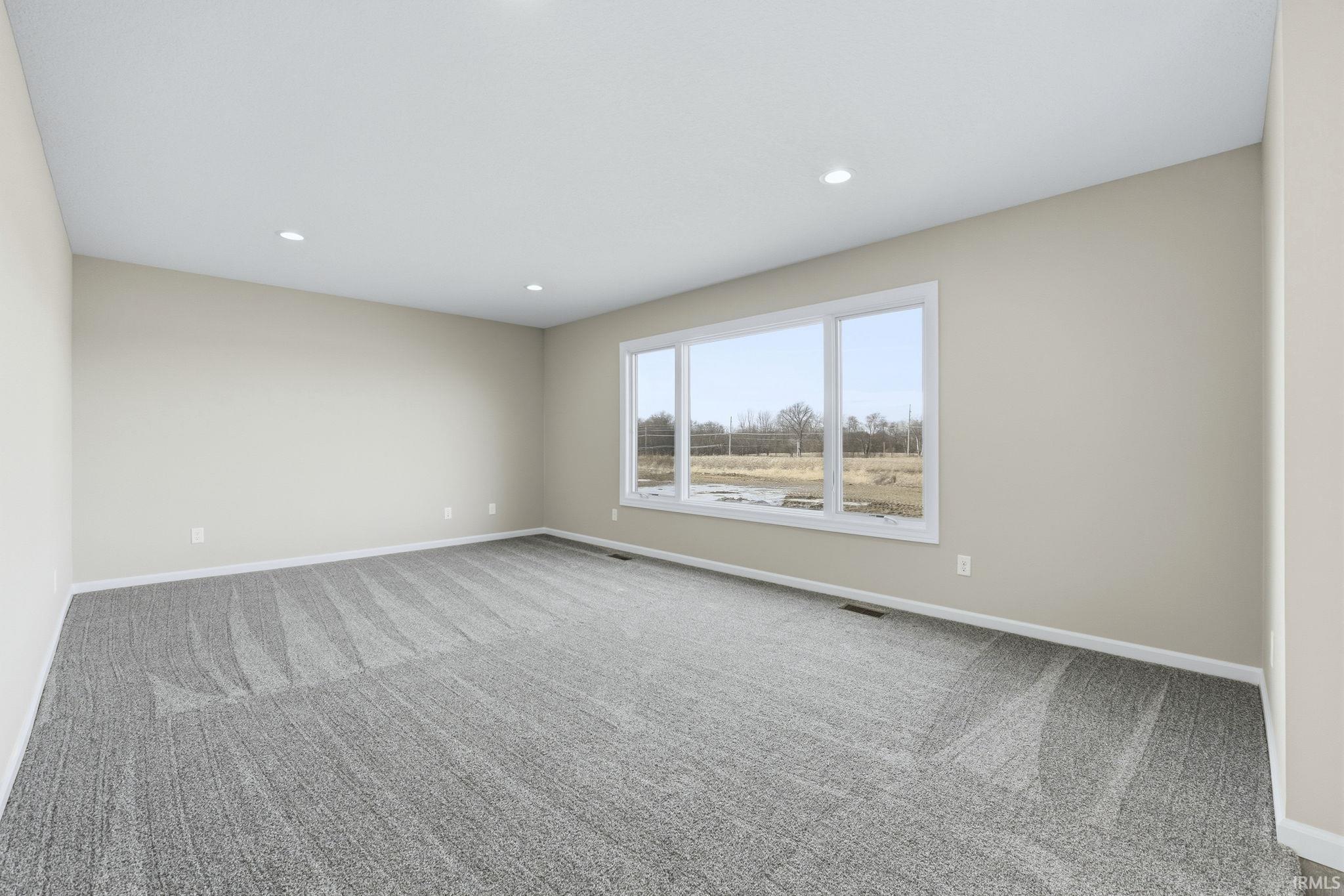 Unfurnished room featuring light colored carpet and recessed lighting